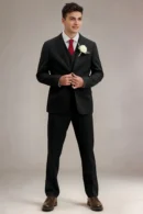 LILVS Jago black slim-fit three-piece suit, model buttoning single-breasted jacket with white rose boutonniere and burgundy tie, full-body front view